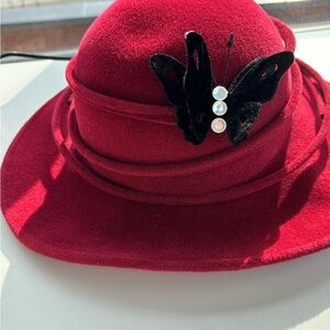 Elegant Red Hat with Butterfly Accent